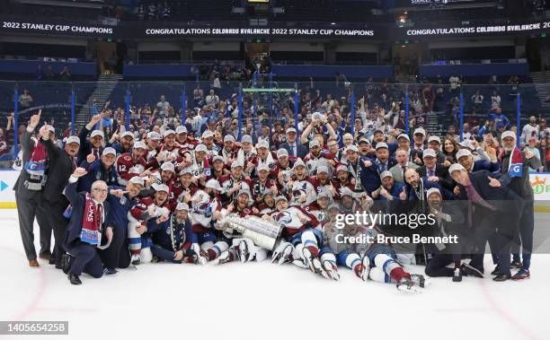 The Colorado Avalanche pose with theStanley Cup following the series winning victory over the Tampa Bay Lightning in Game Six of the 2022 NHL Stanley...