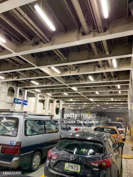 inside of interislander ferry, wellington, new zealand - parking deck stock pictures, royalty-free photos & images