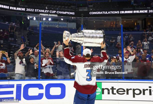 Jack Johnson of he Colorado Avalanche carries the Stanley Cup following the series winning victory over the Tampa Bay Lightning in Game Six of the...