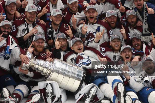 The Colorado Avalanche poses with the Stanley Cup after winning Game Six of the 2022 NHL Stanley Cup Final at Amalie Arena on June 26, 2022 in Tampa,...