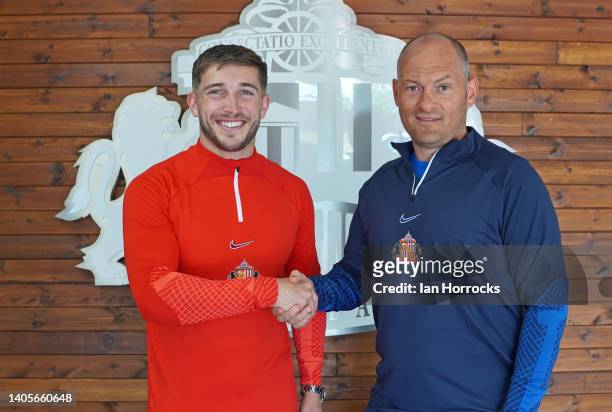 Sunderland player Lynden Gooch poses for a photo shaking hands with after manager Alex Neil after signing a contract extension at The Academy of...