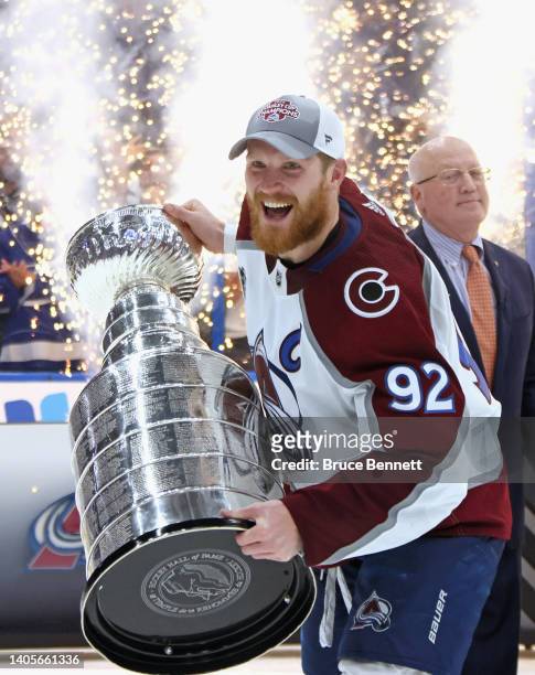 Gabriel Landeskog of the Colorado Avalanche carries the Stanley Cup following the series winning victory over the Tampa Bay Lightning in Game Six of...