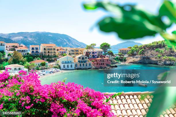 colorful beach town by crystal sea in summer, greece - idyllic greece stock pictures, royalty-free photos & images