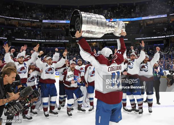 Andrew Cogliano of the Colorado Avalanche carries the Stanley Cup following the series winning victory over the Tampa Bay Lightning in Game Six of...