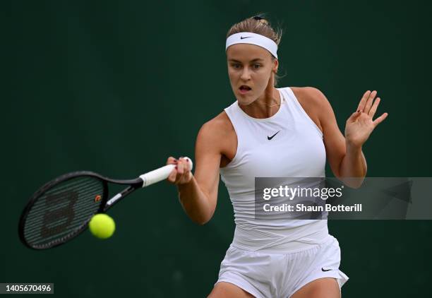 Anna Karolina Schmiedlova plays a forehand against Rebecca Peterson of Sweden of Slovakia during their Women's Singles First Round Match on day two...