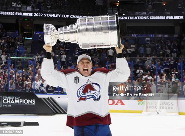 Jack Johnson of the Colorado Avalanche carries the Stanley Cup following the series winning victory over the Tampa Bay Lightning in Game Six of the...