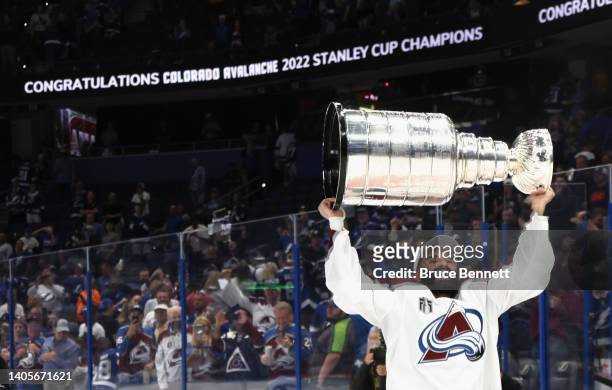 Nazem Kadri of the Colorado Avalanche carries the Stanley Cup following the series winning victory over the Tampa Bay Lightning in Game Six of the...