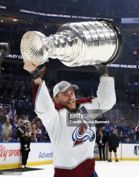 Mikko Rantanen of the Colorado Avalanche carries the Stanley Cup following the series winning victory over the Tampa Bay Lightning in Game Six of the...