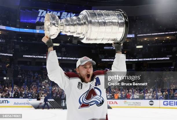 Mikko Rantanen of the Colorado Avalanche carries the Stanley Cup following the series winning victory over the Tampa Bay Lightning in Game Six of the...