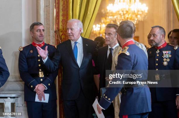 President Joe Biden and French President Emmanuel Macron as they arrive at the Royal Gala dinner for NATO Summit participants at the Royal Palace,...