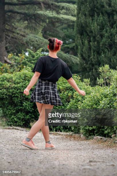 full length body size photo of dreamy cheerful happy modern girl dancing in dress in park - short skirt teens stock pictures, royalty-free photos & images