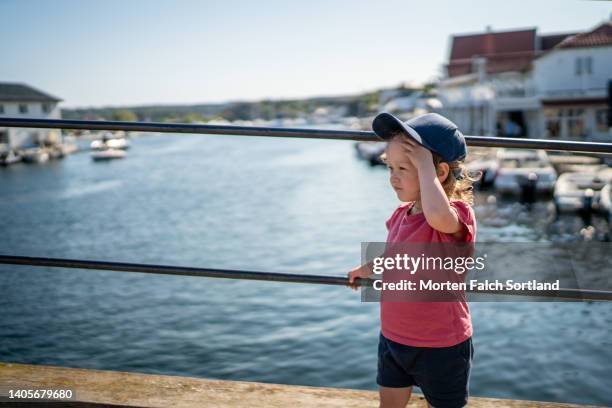 baby girl bravely exploring kragerø - kragerø stock pictures, royalty-free photos & images