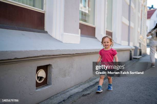 baby girl bravely exploring the streets of kragerø, norway - kragerø stock pictures, royalty-free photos & images