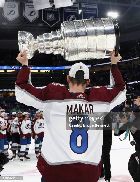 Cale Makar of the Colorado Avalanche carries the Stanley Cup following the series winning victory over the Tampa Bay Lightning in Game Six of the...