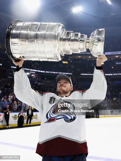 H8#2of the Colorado Avalanche carries the Stanley Cup following the series winning victory over the Tampa Bay Lightning in Game Six of the 2022 NHL...