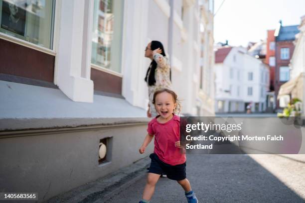 mom and her baby girl exploring kragerø, norway together - kragerø stock pictures, royalty-free photos & images