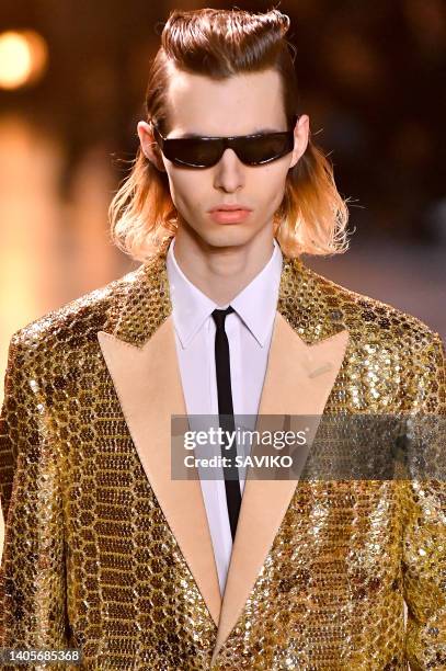 Model walks the runway during the Celine Ready to Wear Spring/Summer 2023 fashion show as part of the Paris Men Fashion Week on June 26, 2022 in...