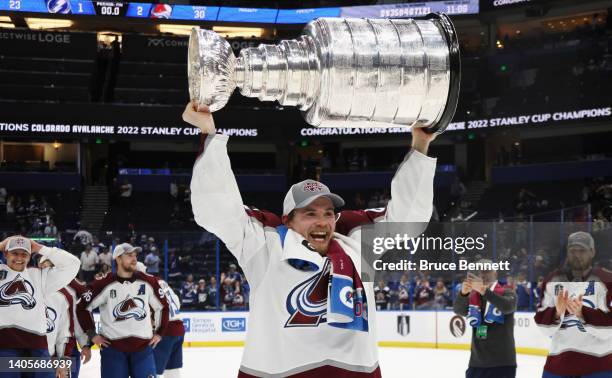 Artturi Lehkonen of the Colorado Avalanche carries the Stanley Cup following the series winning victory over the Tampa Bay Lightning in Game Six of...