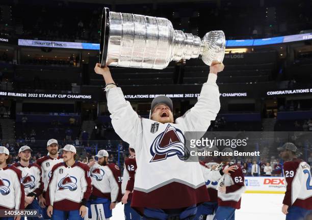 Nico Sturm of the Colorado Avalanche carries the Stanley Cup following the series winning victory over the Tampa Bay Lightning in Game Six of the...