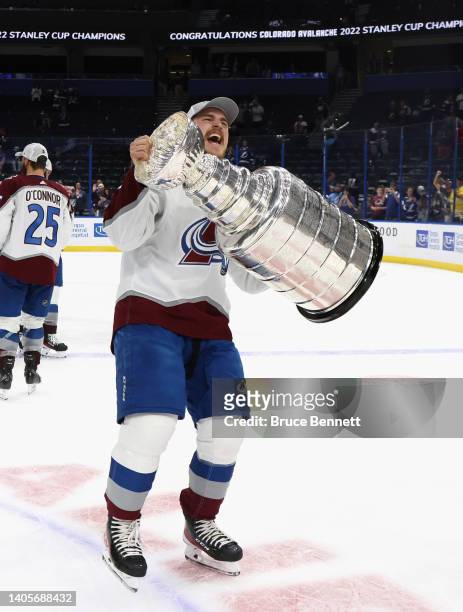 Nicolas Aube-Kubel of the Colorado Avalanche carries the Stanley Cup following the series winning victory over the Tampa Bay Lightning in Game Six of...