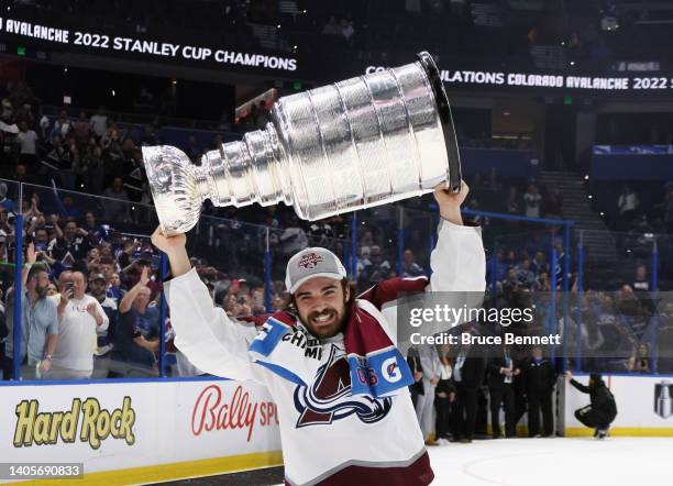 Alex Newhook of the Colorado Avalanche carries the Stanley Cup following the series winning victory over the Tampa Bay Lightning in Game Six of the...