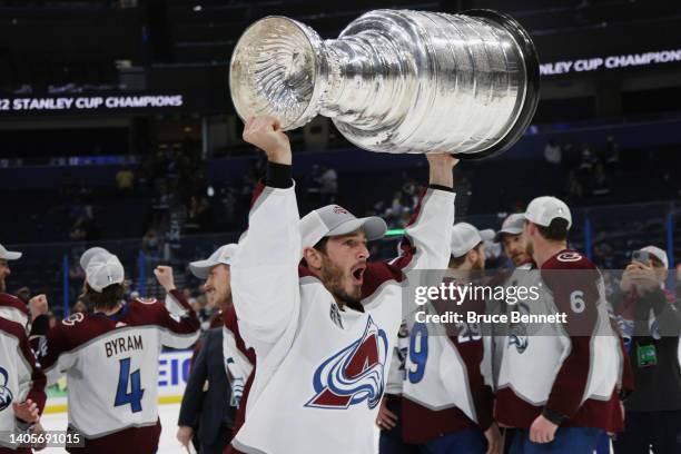 Jayson Megna of the Colorado Avalanche lifts the Stanley Cup after defeating the Tampa Bay Lightning 2-1 in Game Six of the 2022 NHL Stanley Cup...