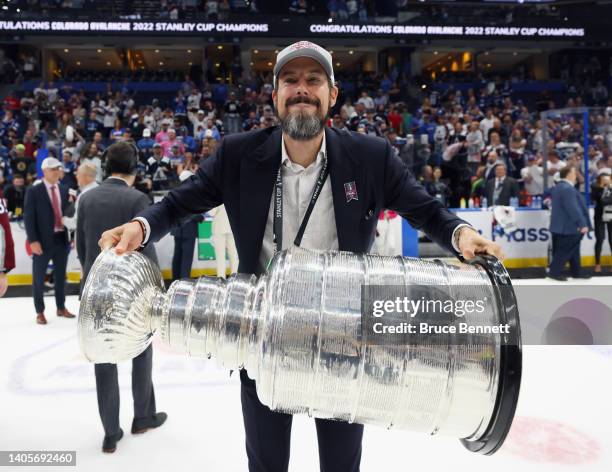 Josh Kroenke of the Colorado Avalanche carries the Stanley Cup following the series winning victory over the Tampa Bay Lightning in Game Six of the...