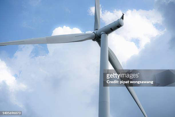 close-up photo of a wind turbine generating electricity. - climate solutions stock pictures, royalty-free photos & images