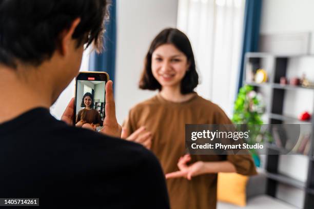 teenagers vlogging - two young arabic children only indoor portrait stock pictures, royalty-free photos & images