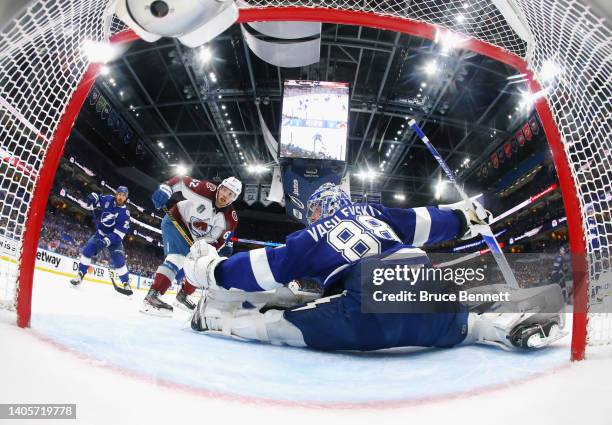 Artturi Lehkonen of the Colorado Avalanche is stopped by Andrei Vasilevskiy of the Tampa Bay Lightning in Game Six of the 2022 NHL Stanley Cup Final...