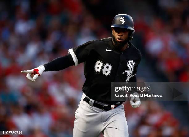 Luis Robert of the Chicago White Sox celebrates a two-run home run against the Los Angeles Angels in the fifth inning at Angel Stadium of Anaheim on...