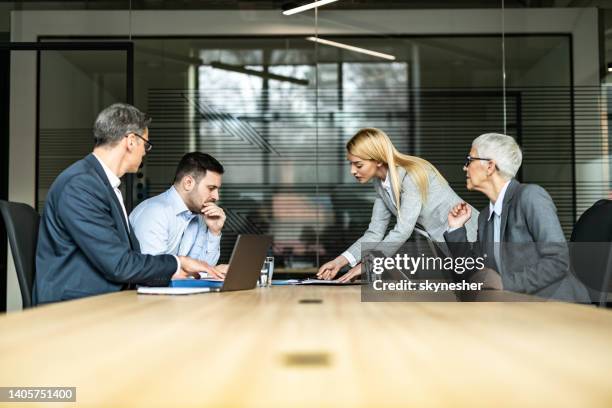 young couple and their lawyers taking about separation in the office. - advocaat juridisch beroep stockfoto's en -beelden