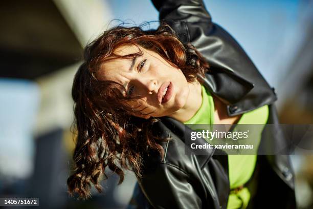 action portrait of young female hip hop dancer - green leather stock pictures, royalty-free photos & images