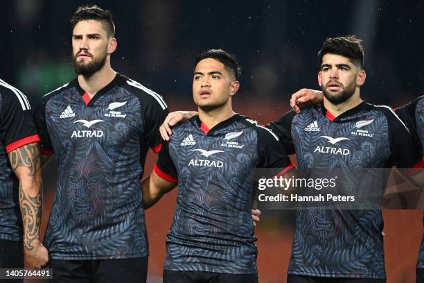 Maanaki Selby Rickit, Josh Ioane and Billy Harmon of the Maori All Blacks sing the anthem during the match between the Maori All Blacks and Ireland...