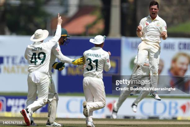 Mitchell Swepson of Australia celebrates with his teammates after dismissing Dinesh Chandimal of Sri Lanka during day one of the First Test in the...