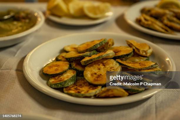 greek food - fried courgette (zucchini) - lesvos, greece - mytilini stockfoto's en -beelden