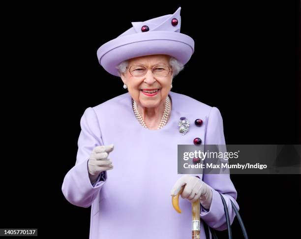 Queen Elizabeth II attends an Armed Forces Act of Loyalty Parade in the gardens of the Palace of Holyroodhouse on June 28, 2022 in Edinburgh,...