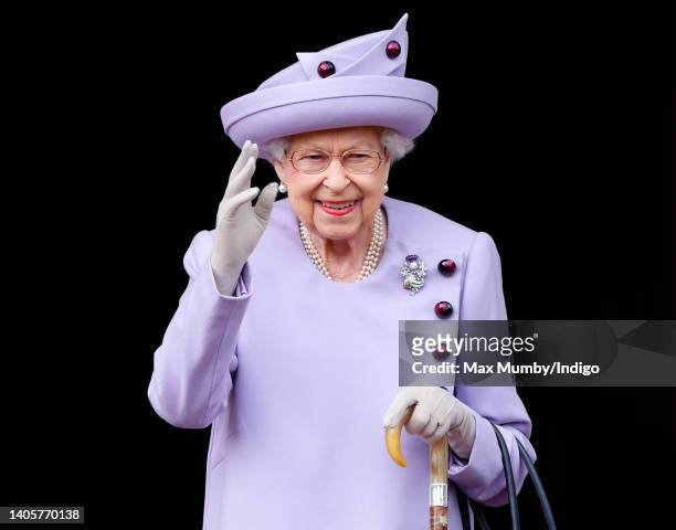 Queen Elizabeth II attends an Armed Forces Act of Loyalty Parade in the gardens of the Palace of Holyroodhouse on June 28, 2022 in Edinburgh,...