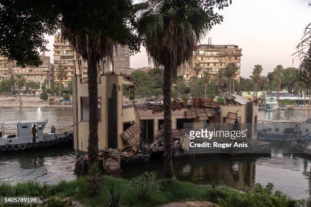 Demolished houseboat is being moved from its place by Imbaba corniche facing the Zamalek neighborhood on June 27, 2022 in Cairo, Egypt. As part of...