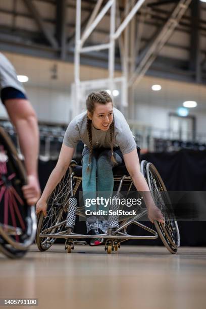 warming up her muscles - wheelchair basketball team stock pictures, royalty-free photos & images