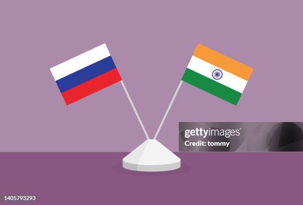 russia and india flag on a table - russian flag stock illustrations