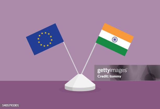 europäische und indische flagge auf einem tisch - pfosten stock-grafiken, -clipart, -cartoons und -symbole