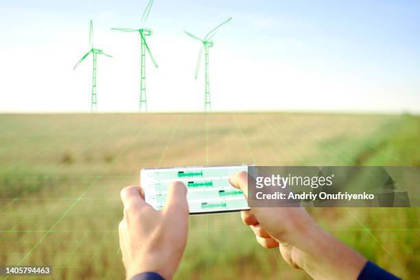 imaginary wind turbines - smartphone hologram stockfoto's en -beelden