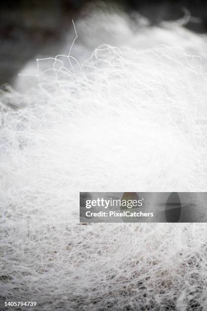 white nylon fishing net abstract background - nylon stockfoto's en -beelden