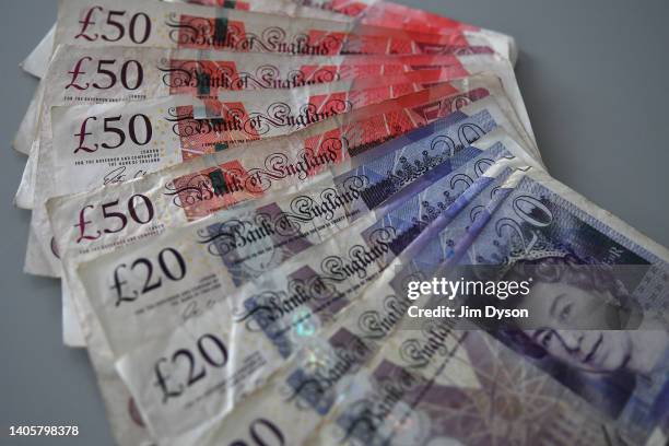 Photo illustration of the British paper £20 and £50 banknotes that will soon be taken out of circulation, June 28, 2022 in London, England. The Bank...