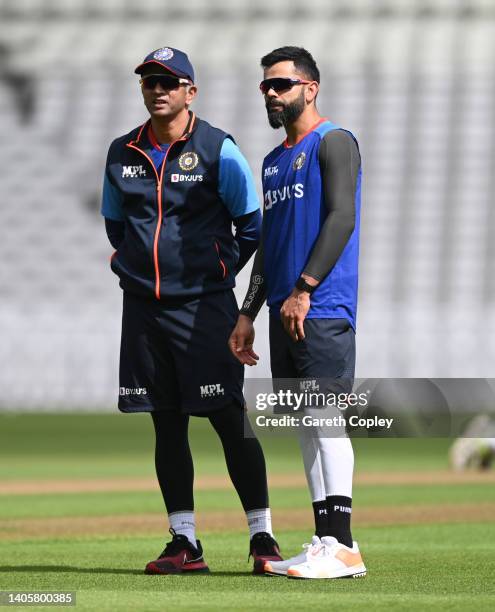 Virat Kohli of India speaks with coach Rahul Dravid during a nets session at Edgbaston on June 29, 2022 in Birmingham, England.