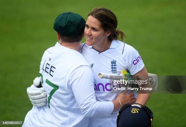 Nat Sciver of England embraces Lizelle Lee of South Africa as they leave the field after finishing unbeaten on 169 during Day Three of the First Test...