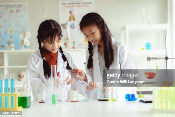 science class stem students with beaker test tube bangkok, thailand - children in a lab stock pictures, royalty-free photos & images