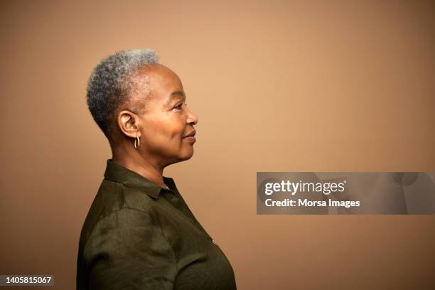 profile shot of african american senior woman, shot on studio. - female portrait studio stock pictures, royalty-free photos & images