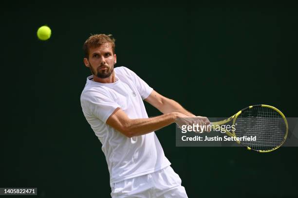 Oscar Otte of Germany plays a backhand against Christian Harrison of United States of America during their Men's Singles Second Round match on day...